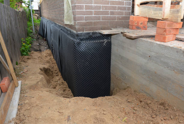 SJ Waterproofing Pros technician performing targeted Wet Basement Repair assessment in Delphos, OH